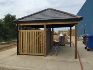 Bike and bin store to side of building